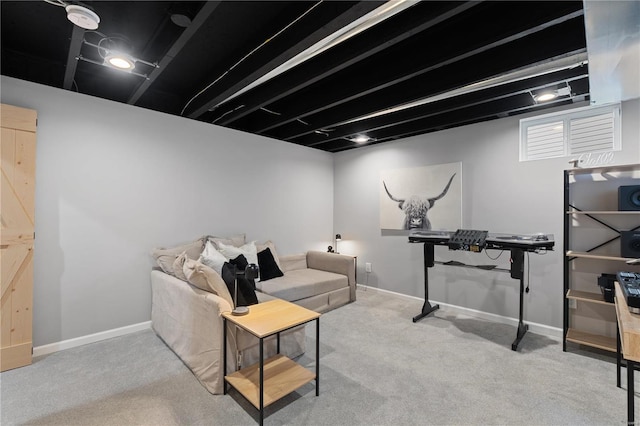 living area featuring baseboards and carpet