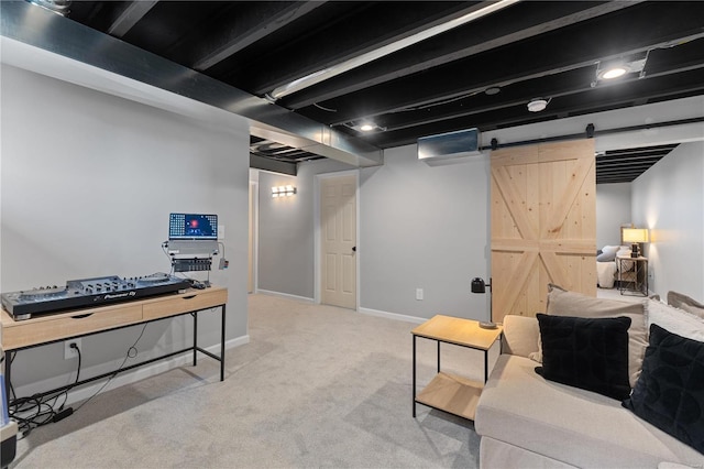 interior space featuring a barn door, carpet, and baseboards