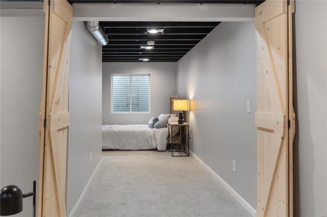 bedroom featuring baseboards and carpet