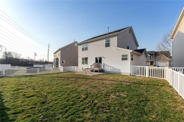 rear view of property with a patio area, a lawn, and a fenced backyard