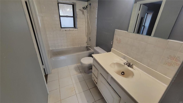 bathroom featuring decorative backsplash, toilet, vanity, shower / washtub combination, and tile patterned flooring