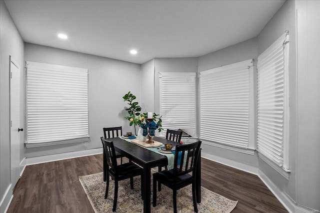 dining space featuring recessed lighting, baseboards, and wood finished floors