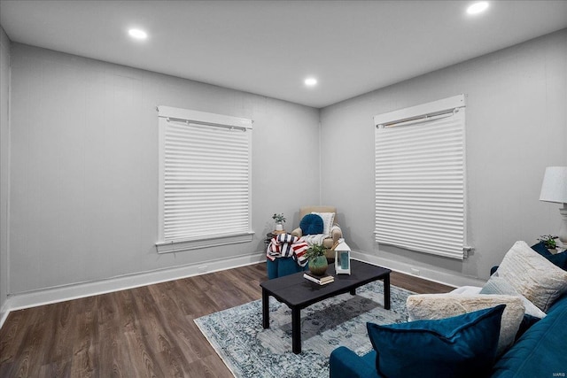 living area with recessed lighting, baseboards, and wood finished floors