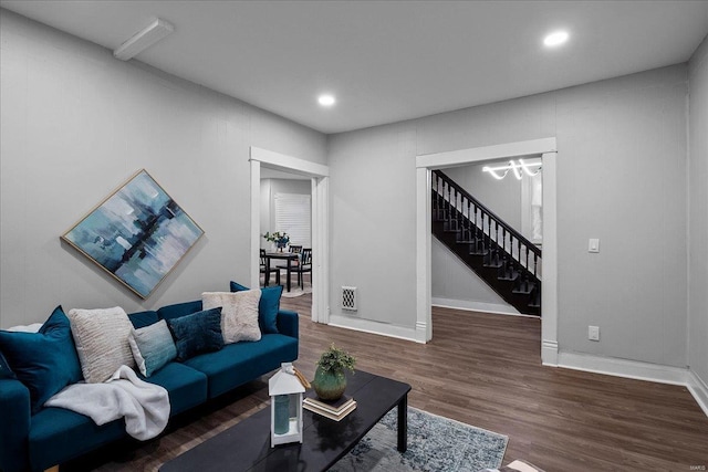 living room with stairway, recessed lighting, wood finished floors, and baseboards