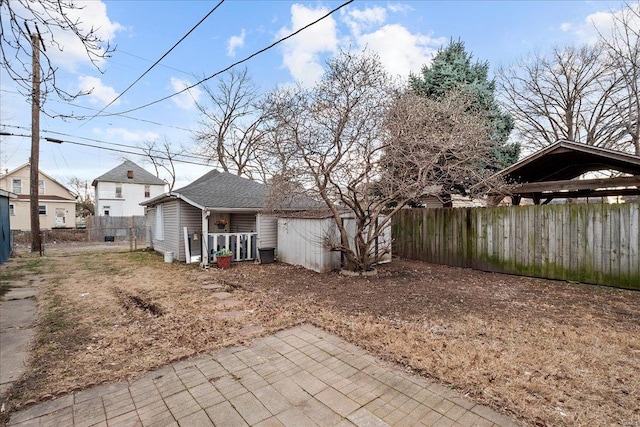 view of yard with an outdoor structure and fence