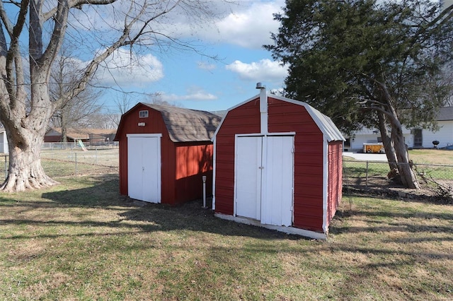 view of shed featuring fence