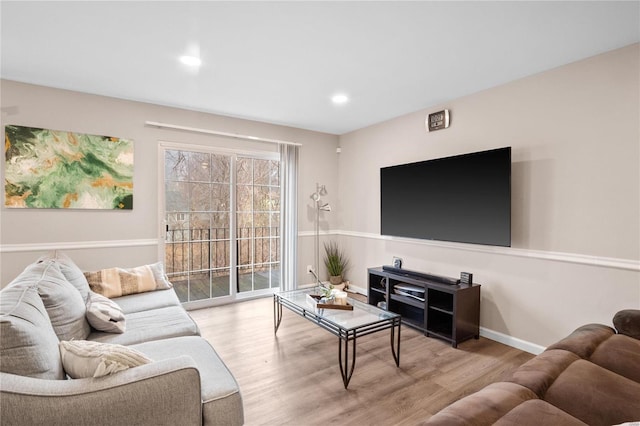 living area with recessed lighting, baseboards, and wood finished floors