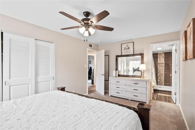 bedroom featuring visible vents, ensuite bathroom, a closet, carpet flooring, and baseboards