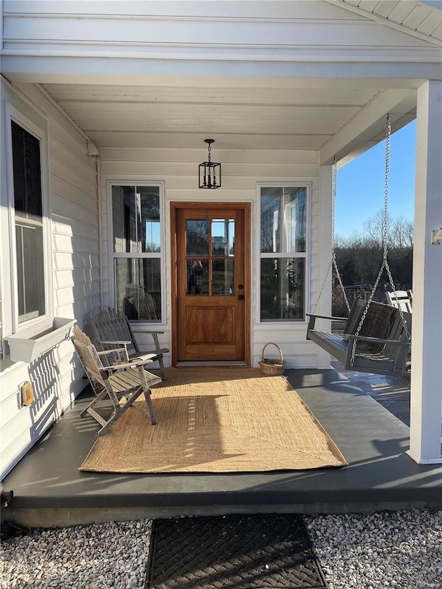 entrance to property featuring a porch