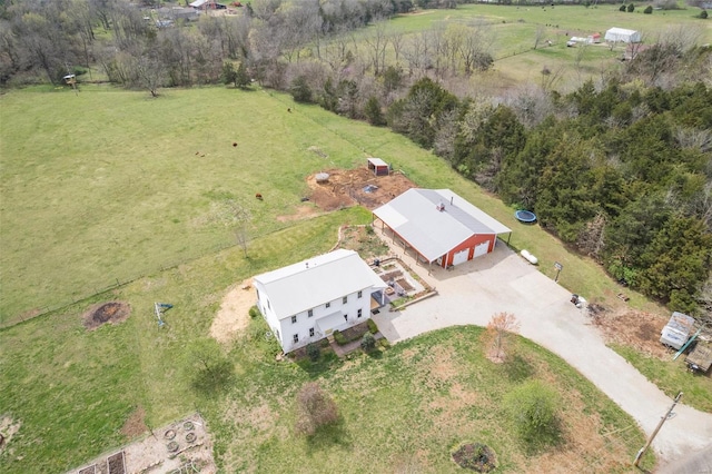 birds eye view of property with a rural view