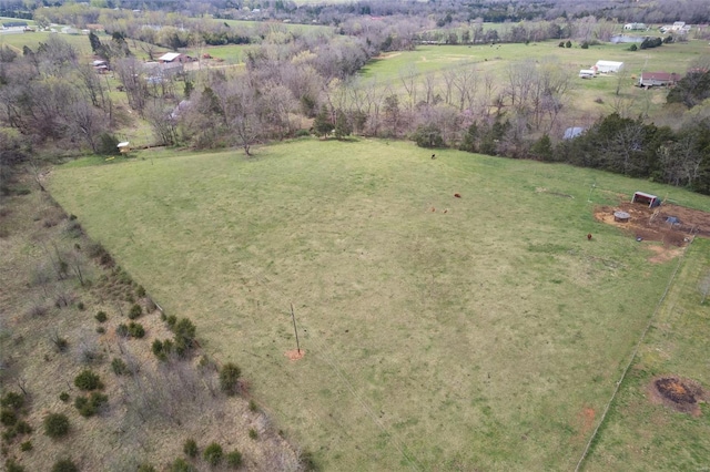 birds eye view of property with a rural view