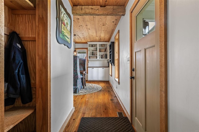 corridor with beamed ceiling, visible vents, wood ceiling, and wood-type flooring