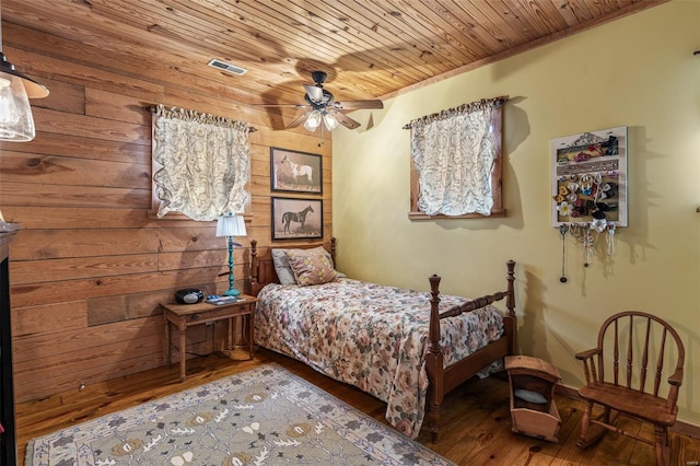 bedroom featuring visible vents, a ceiling fan, wooden ceiling, and hardwood / wood-style floors