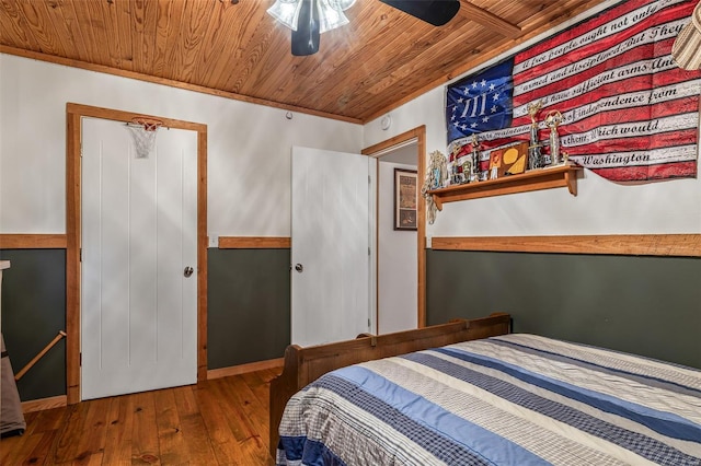 bedroom with hardwood / wood-style floors, a ceiling fan, and wooden ceiling