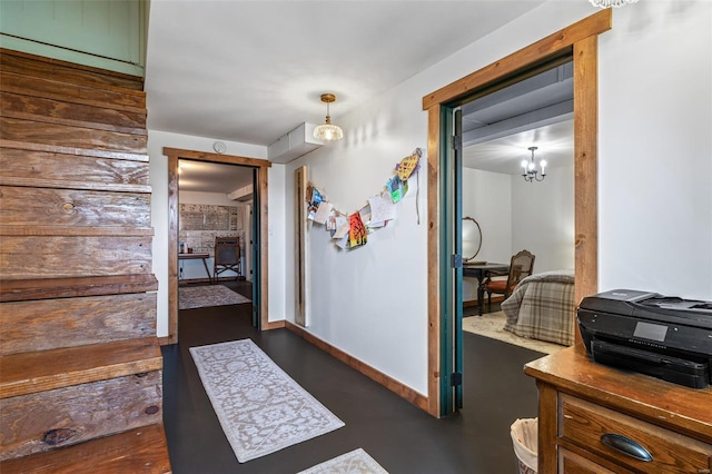 hall featuring baseboards