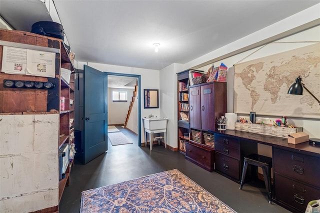 home office featuring concrete floors