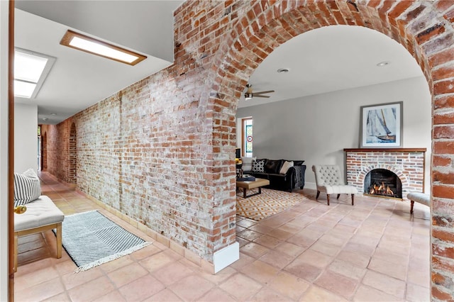 hallway with arched walkways and brick wall