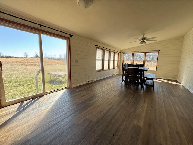 unfurnished sunroom with visible vents, ceiling fan, and vaulted ceiling