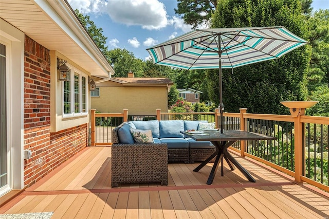 wooden terrace featuring outdoor lounge area