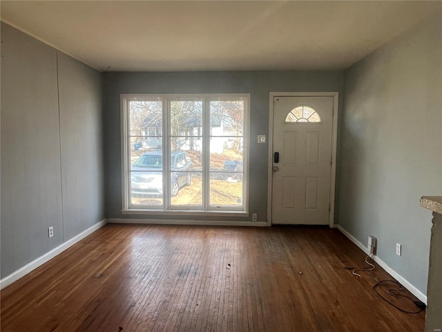 foyer with hardwood / wood-style flooring and baseboards