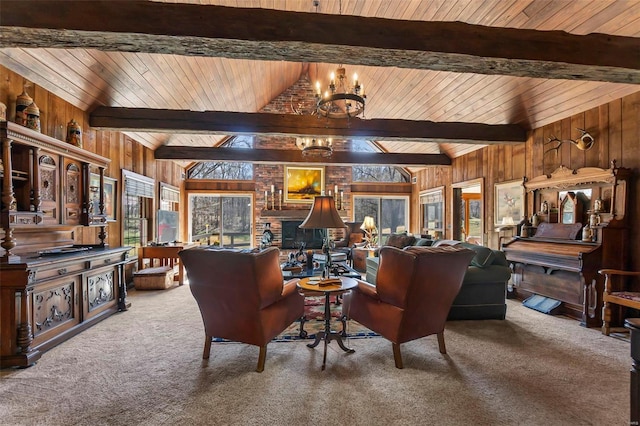 carpeted living room featuring a chandelier, wooden walls, a fireplace, vaulted ceiling with beams, and wood ceiling