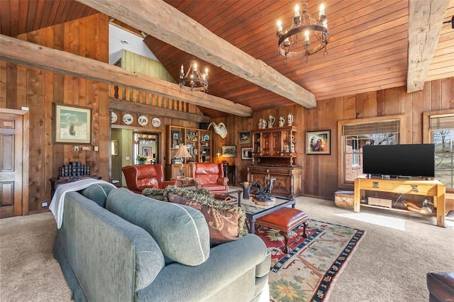 carpeted living area featuring wooden ceiling, a notable chandelier, wood walls, and vaulted ceiling with beams