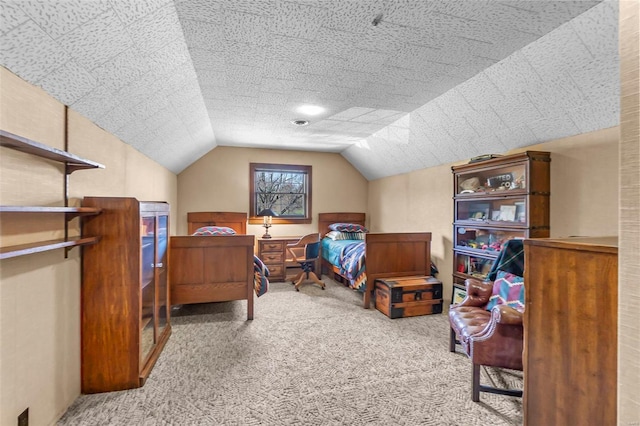 carpeted bedroom featuring lofted ceiling