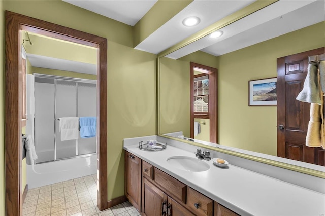 full bath featuring tile patterned floors, enclosed tub / shower combo, recessed lighting, and vanity