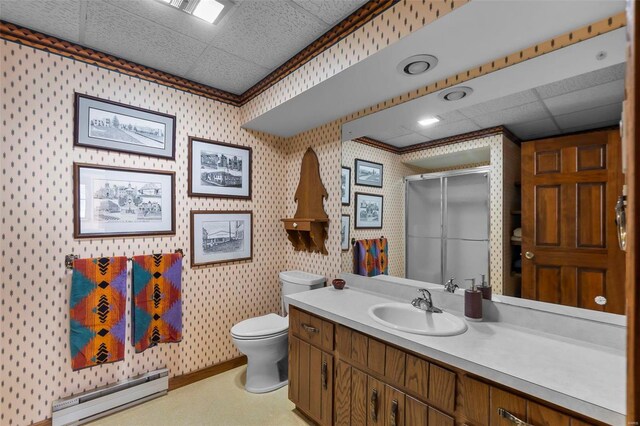 full bathroom featuring a stall shower, toilet, vanity, wallpapered walls, and a baseboard heating unit