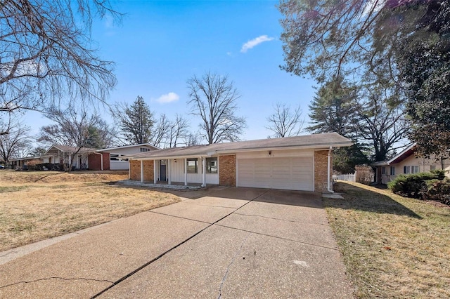 ranch-style home with driveway, a front yard, brick siding, and an attached garage