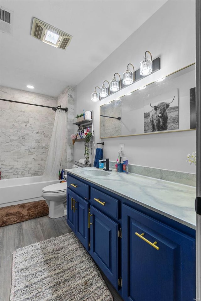 full bath with vanity, toilet, visible vents, and shower / tub combo with curtain