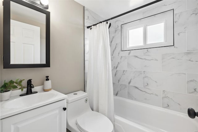 full bathroom with toilet, vanity, and shower / bath combo