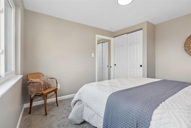 bedroom with baseboards and carpet