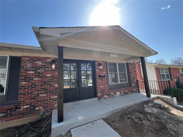 entrance to property with french doors and brick siding