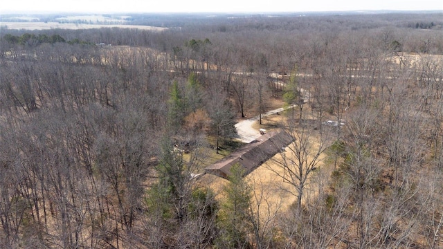 drone / aerial view with a view of trees