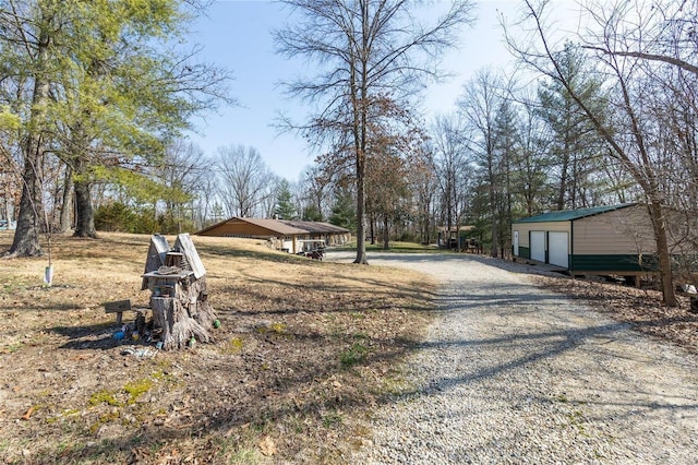 view of road with driveway