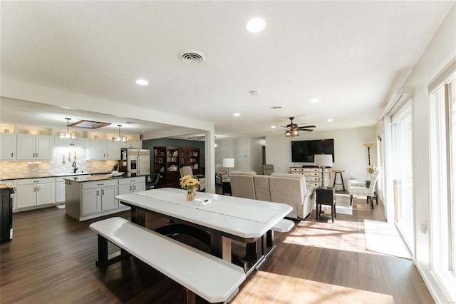 dining area with dark wood finished floors, recessed lighting, and a ceiling fan