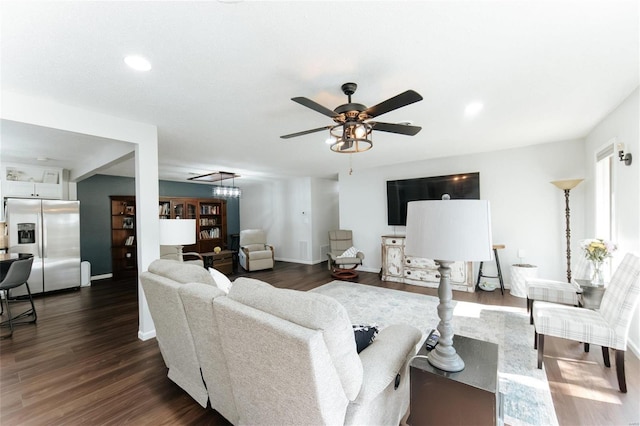 living room featuring recessed lighting, baseboards, dark wood-type flooring, and a ceiling fan