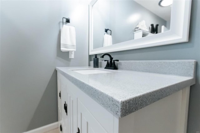 bathroom featuring vanity and baseboards