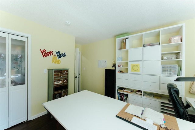 office area with dark wood-style floors