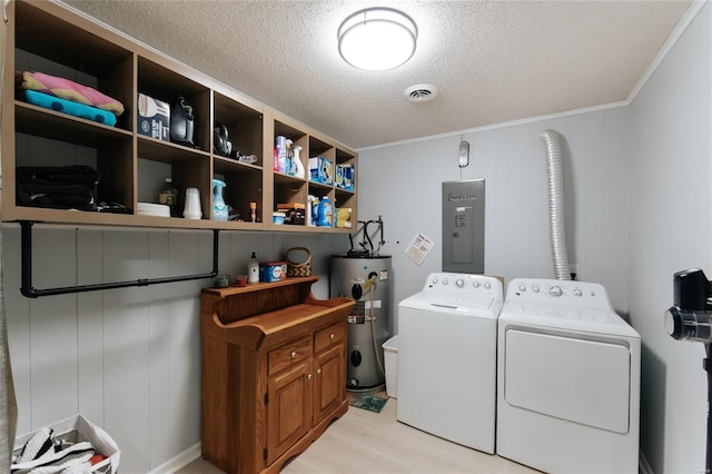 laundry area featuring visible vents, washer and dryer, electric water heater, a textured ceiling, and laundry area