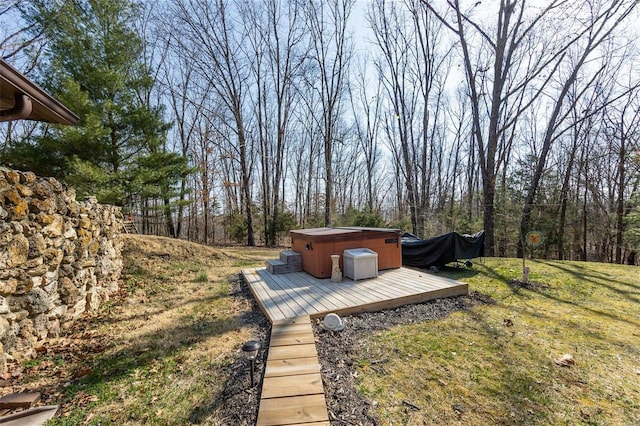 view of yard with a deck and a hot tub