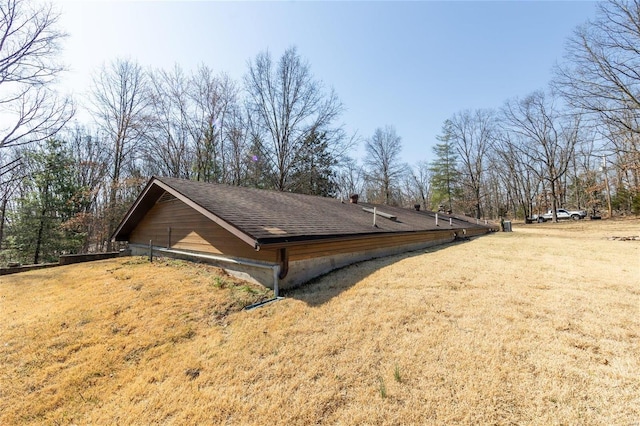 view of property exterior featuring a lawn