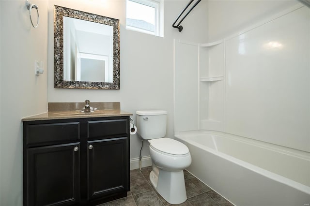 bathroom featuring vanity, baseboards, tile patterned flooring, shower / bath combination, and toilet