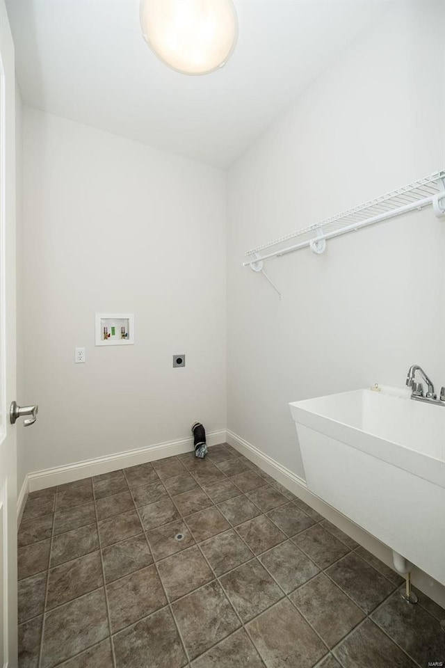 laundry room with hookup for a washing machine, baseboards, hookup for an electric dryer, laundry area, and a sink