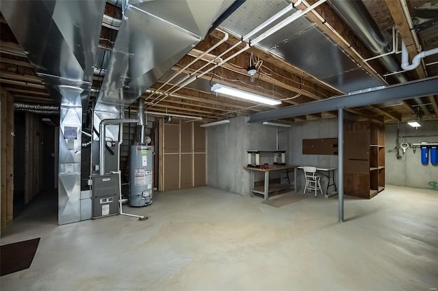 unfinished below grade area with gas water heater and heating unit