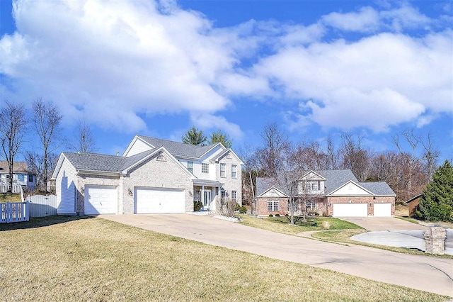 view of front of house with driveway, a front lawn, fence, an attached garage, and brick siding