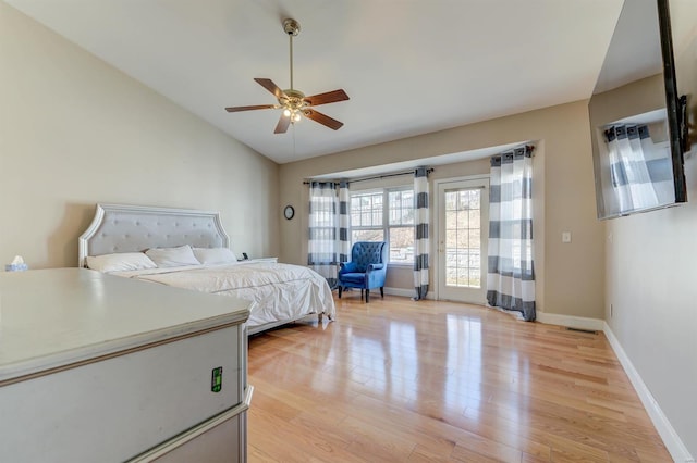 bedroom featuring baseboards, lofted ceiling, light wood-style flooring, ceiling fan, and access to exterior