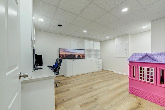 office with recessed lighting, light wood-style floors, baseboards, and a drop ceiling