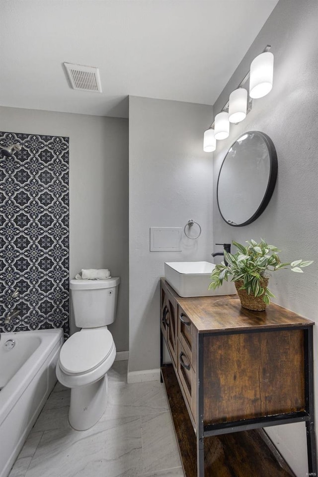 bathroom with visible vents, toilet, baseboards, a bath, and vanity